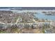 Aerial view showcases waterfront properties and a scenic neighborhood near the lake at 9914 Springstone Rd, Fishers, IN 46055