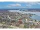 Stunning aerial view of a lakeside community featuring a home with a pool and nearby Indianapolis Yacht Club at 9914 Springstone Rd, Fishers, IN 46055