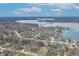 Aerial community view featuring many trees, a lake and sprawling single-Gathering homes at 9914 Springstone Rd, Fishers, IN 46055