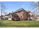 Lovely backyard featuring a deck, screened porch, and large brick house at 9914 Springstone Rd, Fishers, IN 46055