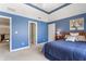 Spacious blue bedroom featuring carpet flooring, natural lighting, and a ceiling fan at 9914 Springstone Rd, Fishers, IN 46055