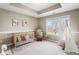 Well-lit ' room with a crib, teepee, and rocking chair, perfect for a cozy and playful space at 9914 Springstone Rd, Fishers, IN 46055