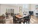 Dining area featuring hardwood floors and table and view to living room at 9914 Springstone Rd, Fishers, IN 46055