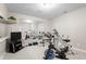 Spacious exercise room with fitness equipment and mirrored wall for a complete workout experience at 9914 Springstone Rd, Fishers, IN 46055