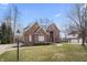 Beautiful brick home with a well-kept lawn, mature trees, and a welcoming entrance at 9914 Springstone Rd, Fishers, IN 46055
