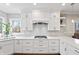 Bright kitchen featuring white cabinets, quartz countertops, subway tile backsplash, and stainless steel appliances at 9914 Springstone Rd, Fishers, IN 46055