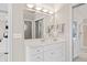 This bathroom is well-lit with a large mirror and a vanity providing the perfect space for relaxation at 9914 Springstone Rd, Fishers, IN 46055