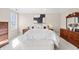 Bright bedroom with neutral tones, a large window, and wood furnishings for a comforting living space at 9914 Springstone Rd, Fishers, IN 46055