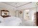 Spacious bedroom featuring carpet flooring, neutral walls, and access to the attached bathroom for added convenience at 9914 Springstone Rd, Fishers, IN 46055
