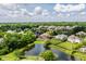 Aerial view of the neighborhood with a pond showing the home's great location at 10541 Titan Run, Carmel, IN 46032