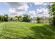 Large manicured backyard with pond at 10541 Titan Run, Carmel, IN 46032