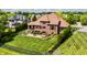 Aerial view of a fenced backyard with an outdoor kitchen, landscaping and a patio at 10541 Titan Run, Carmel, IN 46032