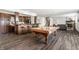 Finished basement boasting a pool table, bar area, and a cozy living space with stone fireplace at 10541 Titan Run, Carmel, IN 46032