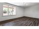 Unfinished basement with a window view to the yard and wood look tile flooring at 10541 Titan Run, Carmel, IN 46032