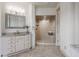 Bathroom features a granite countertop vanity and a frameless glass shower with tiled surround at 10541 Titan Run, Carmel, IN 46032