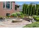 Fire pit area surrounded by lush landscaping at 10541 Titan Run, Carmel, IN 46032