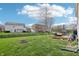Large backyard featuring a lawn, deck, and privacy fence; great for outdoor activities at 10887 Gresham Pl, Noblesville, IN 46060