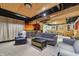 Finished basement with multiple seating areas and a kitchenette, great for entertaining at 10887 Gresham Pl, Noblesville, IN 46060