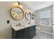 Stylish bathroom featuring a double vanity, designer tile floor, and a glass shower at 10887 Gresham Pl, Noblesville, IN 46060