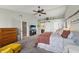 Bright primary bedroom with vaulted ceilings, ceiling fan, and a king-sized bed at 10887 Gresham Pl, Noblesville, IN 46060