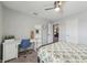 Bright bedroom with a desk, bed, ceiling fan, and lots of natural light from the window at 10887 Gresham Pl, Noblesville, IN 46060