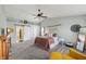 Bright primary bedroom with vaulted ceilings, ceiling fan, barn door to bath, and a king-sized bed at 10887 Gresham Pl, Noblesville, IN 46060