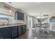 Kitchen area featuring sleek countertops, blue cabinets, stainless steel appliances, and abundant natural light at 10887 Gresham Pl, Noblesville, IN 46060