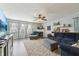 Comfortable living room with fireplace, ceiling fan, and plush furnishings at 10887 Gresham Pl, Noblesville, IN 46060