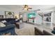 Spacious living room with plush seating, modern decor, and open floor plan at 10887 Gresham Pl, Noblesville, IN 46060