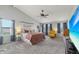 Spacious main bedroom with a ceiling fan, neutral carpeting, and natural light from multiple windows at 10887 Gresham Pl, Noblesville, IN 46060