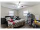 Bedroom with a ceiling fan, neutral walls, plank flooring, and natural light at 1142 Sharon Ave, Indianapolis, IN 46222