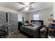 Bedroom with a ceiling fan, neutral walls, plank flooring, and natural light at 1142 Sharon Ave, Indianapolis, IN 46222