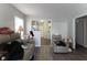 Bright living area featuring plank flooring, neutral walls, and an archway to the kitchen at 1142 Sharon Ave, Indianapolis, IN 46222