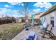 Backyard featuring a stone patio with furniture, a shed, a grill and a swing set at 12689 Sovereign Ln, Fishers, IN 46038