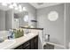 Bathroom featuring double vanity sinks, and a window above the toilet at 12689 Sovereign Ln, Fishers, IN 46038