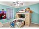 bedroom featuring a bunk bed with toys and drawers, bright walls, and a ceiling fan at 12689 Sovereign Ln, Fishers, IN 46038