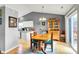 Cozy dining area with wood table, hardwood floors, and a sliding glass door to the backyard at 12689 Sovereign Ln, Fishers, IN 46038