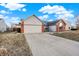 Inviting single-story home with a driveway, brick accents and a well-maintained lawn at 12689 Sovereign Ln, Fishers, IN 46038