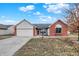 Charming single-story home with a two-car garage, brick accents and manicured front yard at 12689 Sovereign Ln, Fishers, IN 46038