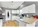 Kitchen with bright white cabinets and stainless steel appliances at 12689 Sovereign Ln, Fishers, IN 46038