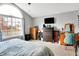 Bedroom with a large window, neutral carpet, and modern furniture at 12689 Sovereign Ln, Fishers, IN 46038