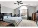 Spacious bedroom featuring carpet, large windows, and a ceiling fan at 12689 Sovereign Ln, Fishers, IN 46038