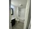 Modern bathroom includes a black vanity, toilet, and shower-tub combo at 1310 N Lasalle St, Indianapolis, IN 46201