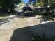 Long driveway with a truck parked at the end in front of a green house at 1310 N Lasalle St, Indianapolis, IN 46201