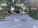 Front-facing view of a black truck in a long gravel driveway at 1310 N Lasalle St, Indianapolis, IN 46201