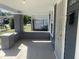 Inviting covered front porch with painted brick columns and secure front door at 1310 N Lasalle St, Indianapolis, IN 46201