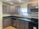 Well-appointed kitchen with gray cabinetry, stainless steel appliances, and ample counter space at 1310 N Lasalle St, Indianapolis, IN 46201