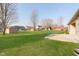 Spacious backyard with a shed and concrete patio, perfect for outdoor activities at 1325 E 47Th St, Anderson, IN 46013