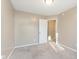 Bedroom with neutral colored walls, carpet flooring, and a door leading to another room at 1325 E 47Th St, Anderson, IN 46013