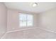 Bedroom with carpet floors, white window with natural light, and neutral colored walls at 1325 E 47Th St, Anderson, IN 46013